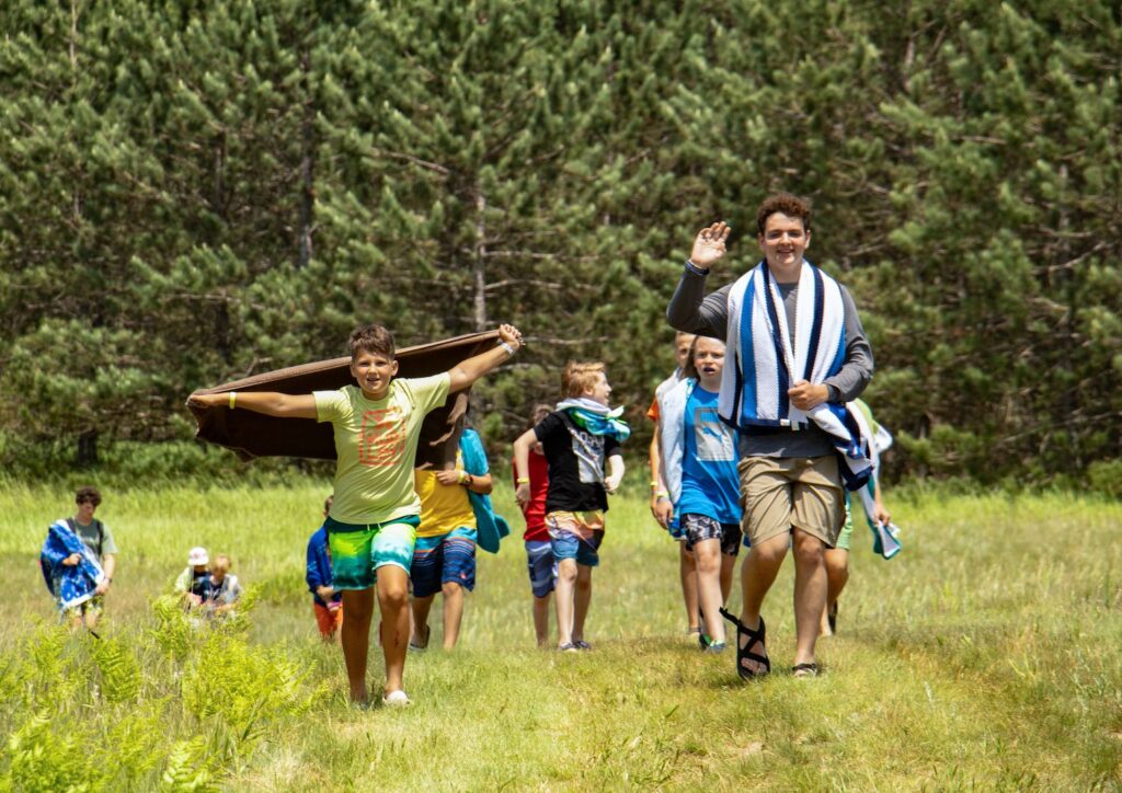 Campers walking through a field